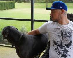 Corbin is an animal lover and owns a big black dog.